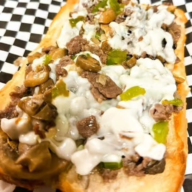 Steak & Cheese Sub 8" + Fries + Can Soda.